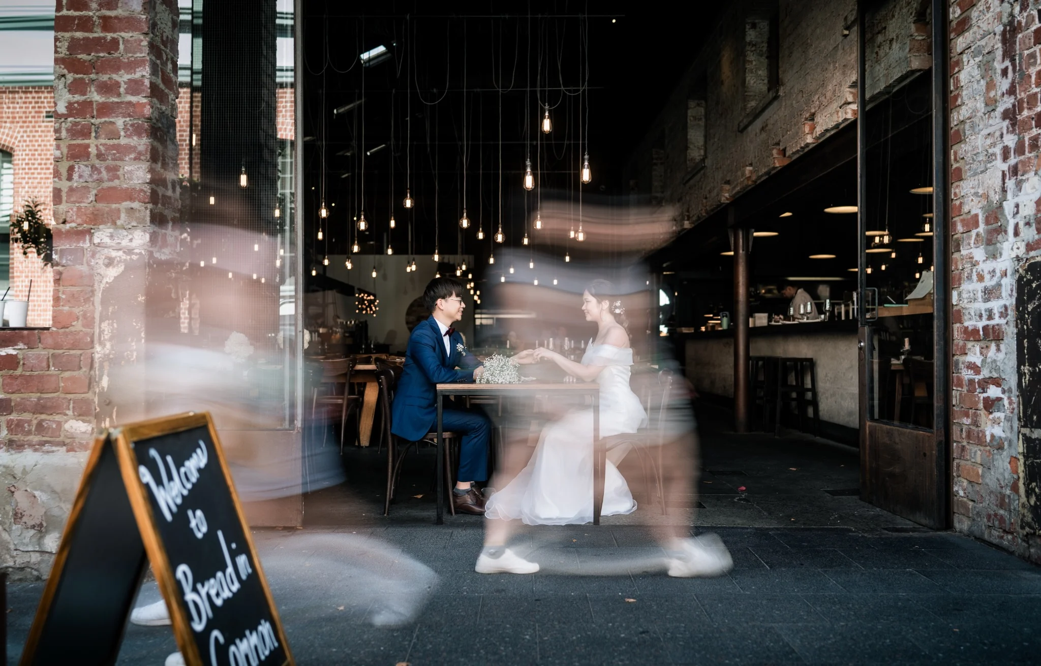 Couple sharing a quiet moment inside a heritage cafe during a Fremantle pre-wedding session