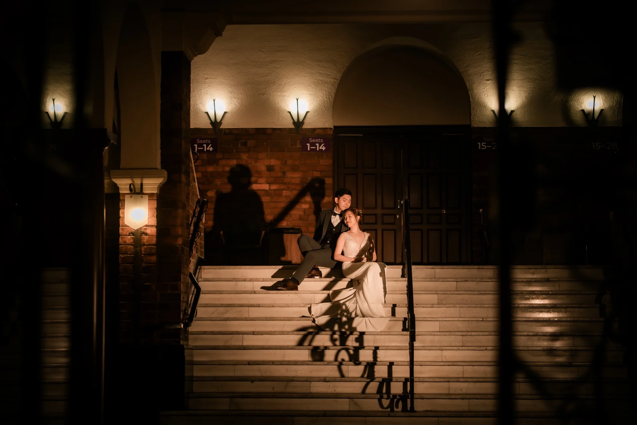 Melody and Ken seated together on UWA steps in Perth, Western Australia