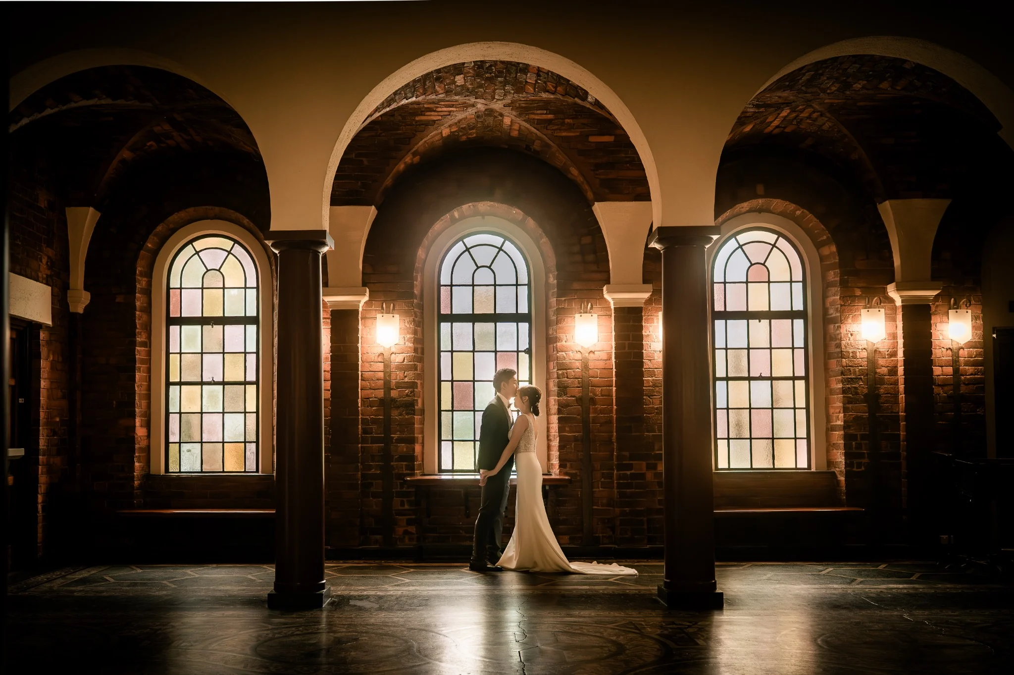 Melody and Ken in a stained glass hall at UWA in Perth, Western Australia