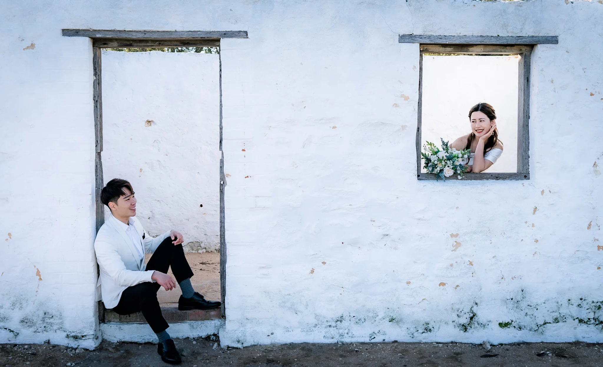 Sharon and Sam framed by a heritage window at Perry's Paddock in Perth, Western Australia