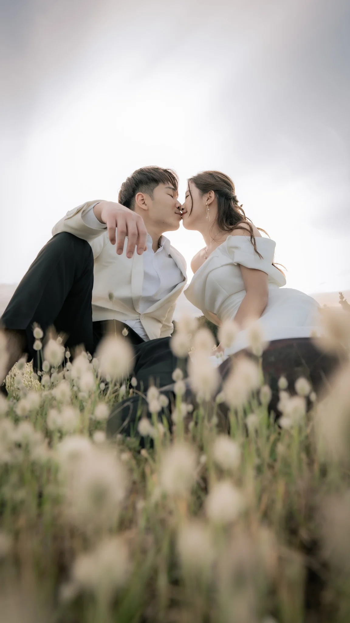 Sharon and Sam sharing a wildflower kiss at Perry's Paddock in Perth, Western Australia